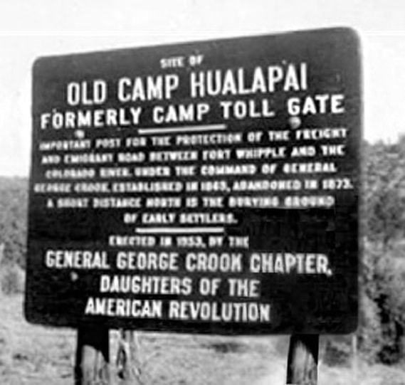 A vintage snapshot of a large sign. Image is blurry.