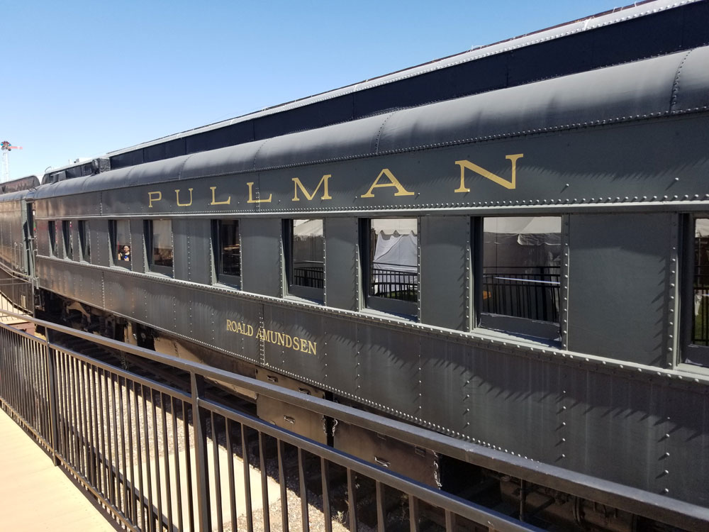 A snapshot of the exterior of a Pullman car, with “Pullman Car” and “Roald Amundsen” on the side.